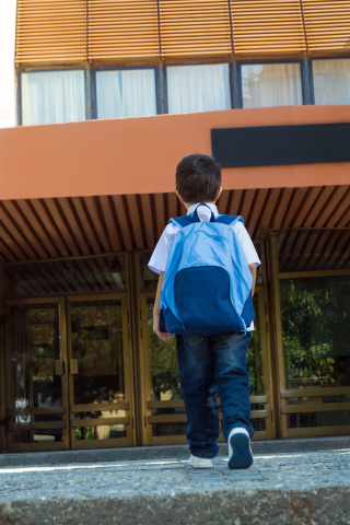 child entering school building